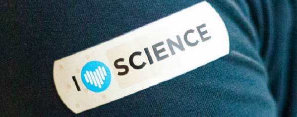 Image of a plaster on someone's T-shirt arm, with the words I love science