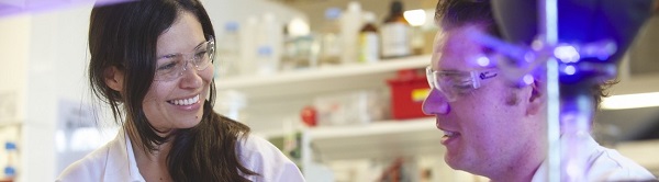Two researchers talking in a lab