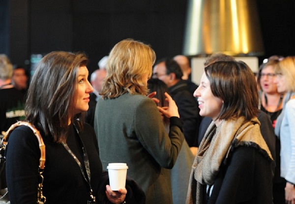 Two women talking at an event