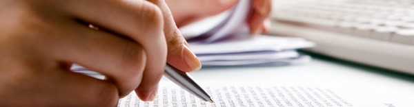 Close up of someone reading through printed text