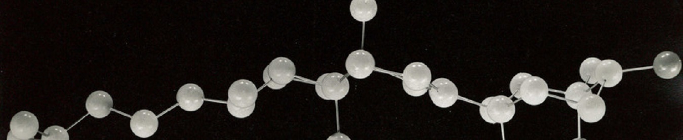 Chemical structure model with plastic balls attached by long wire