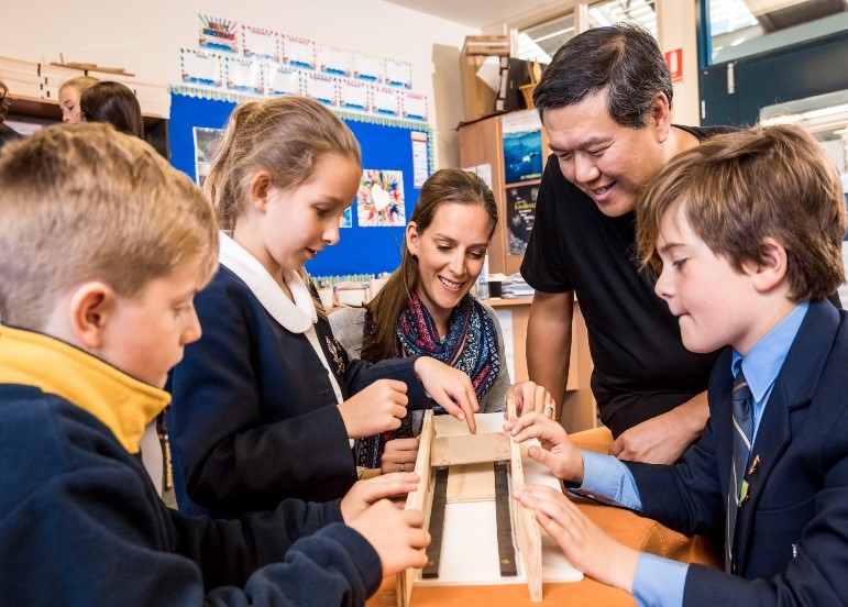 Teacher teaching children