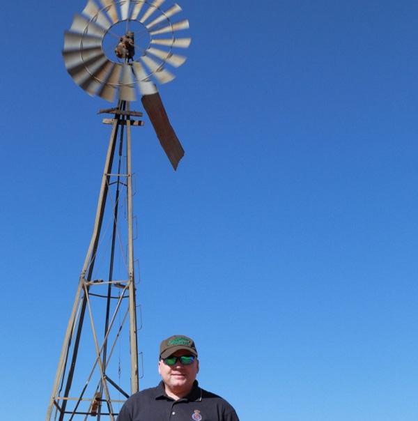 Kevin Ferguson in front of a windmill at the MRO