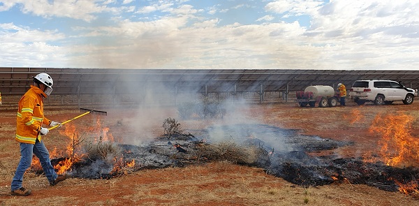 The team conducting a small permitted controlled burn out at site near the solar hybrid power station soon after their bushfire fighting safety training.