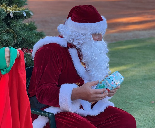 Santa put in an appearance at the Christmas tree, with a present for each of the kids and lollies galore.
