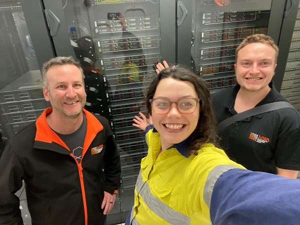 From left to right: Greg Sleap, Mia Walker and Harrison Barlow, in the MRO Control Building in front of newly installed correlator servers for the MWA. Credit: Mia Walker, MWA.