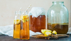 glasses and jars of kombucha