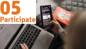 Close up of person on a laptop and a smart phone at the same time