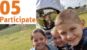 kids and an astronaut in costume at the Dish