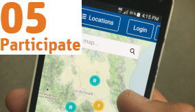 close up of a hand holding a mobile phone with a map on it