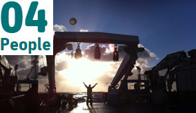 A scientist releases a balloon from the RV Investigator