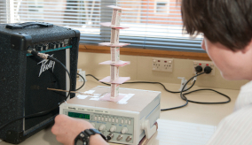 A child doing a science experiment at school